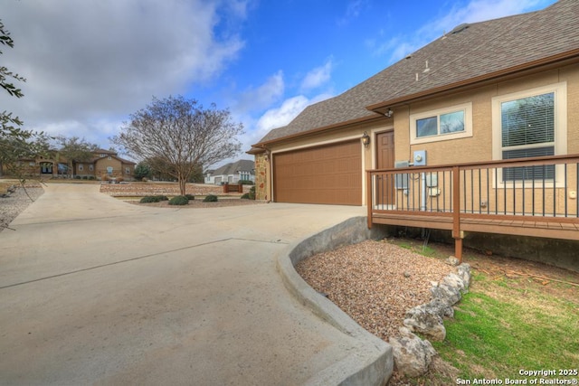 view of property exterior with a garage