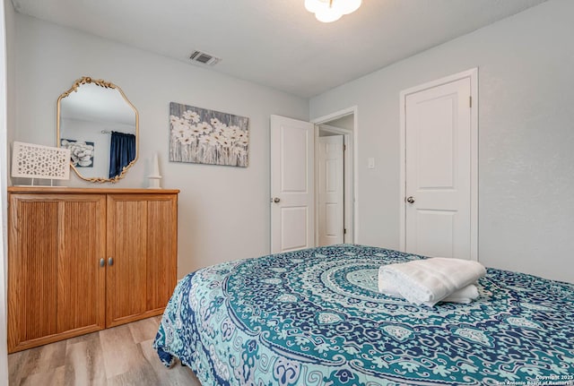 bedroom featuring light wood-type flooring