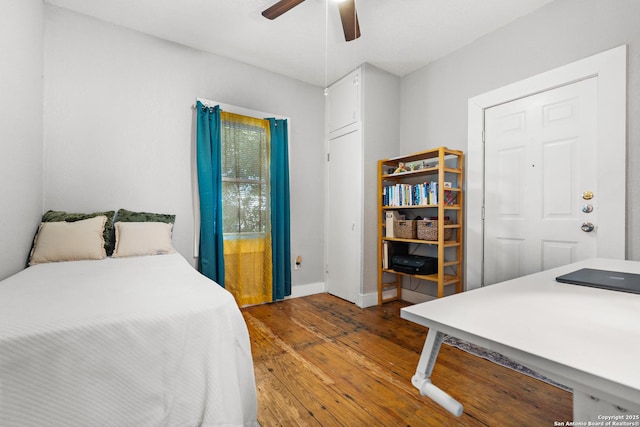 bedroom with ceiling fan and light hardwood / wood-style flooring