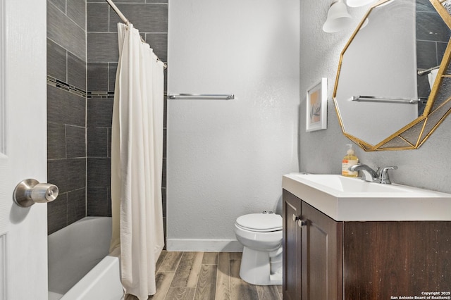 full bathroom with hardwood / wood-style flooring, shower / bathtub combination with curtain, vanity, and toilet