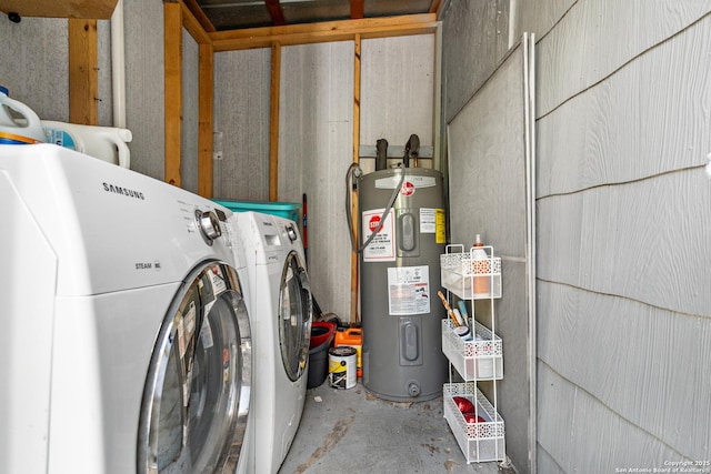 washroom with water heater and independent washer and dryer