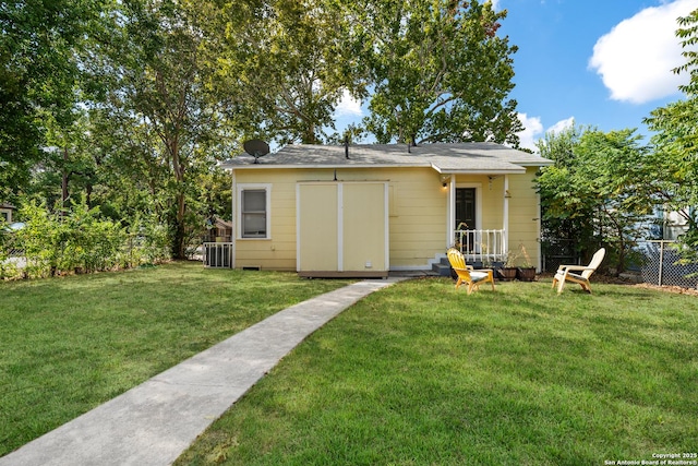 view of outbuilding featuring a yard and central air condition unit