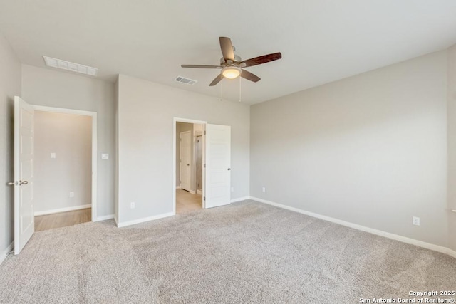 unfurnished bedroom with light carpet and ceiling fan