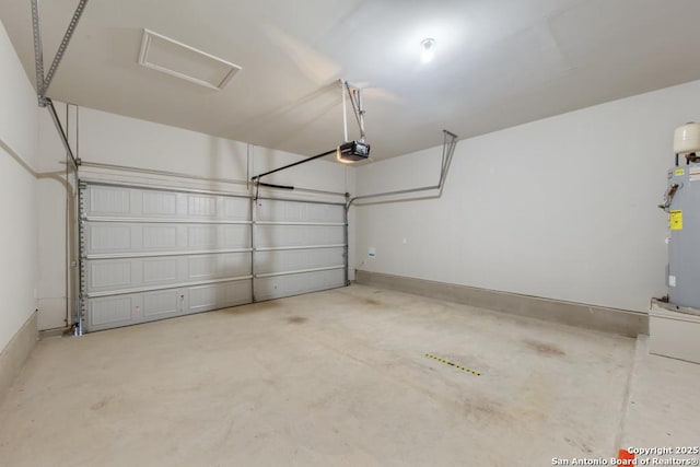 garage with a garage door opener and water heater