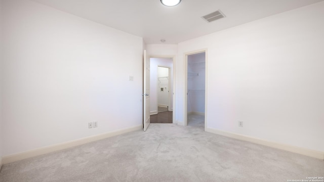 unfurnished room with light colored carpet