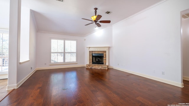 unfurnished living room with lofted ceiling, ceiling fan, hardwood / wood-style floors, a fireplace, and ornamental molding