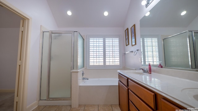 bathroom with lofted ceiling and a wealth of natural light