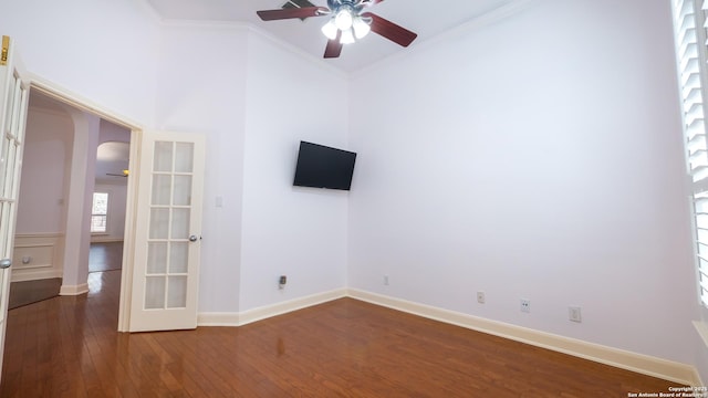 unfurnished room with french doors, ceiling fan, wood-type flooring, and crown molding