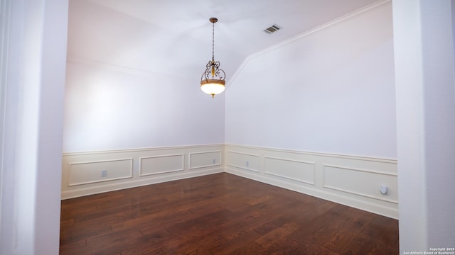 empty room with crown molding and dark wood-type flooring