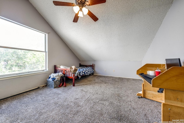 carpeted bedroom featuring ceiling fan, vaulted ceiling, and a textured ceiling