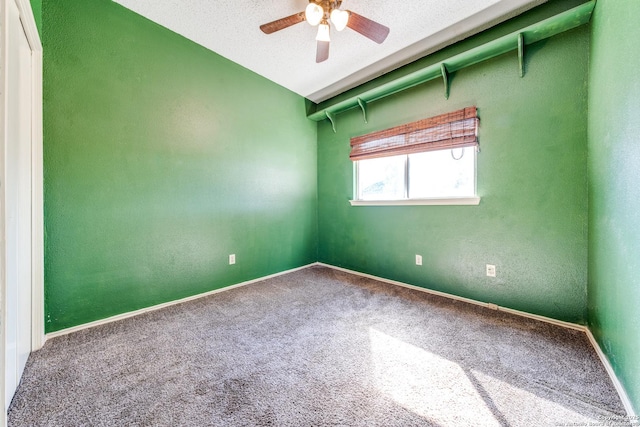 unfurnished room with carpet floors, a textured ceiling, and ceiling fan