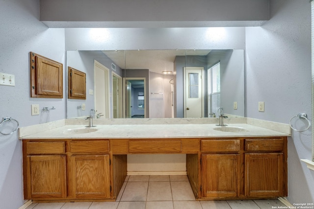 bathroom with vanity and tile patterned flooring