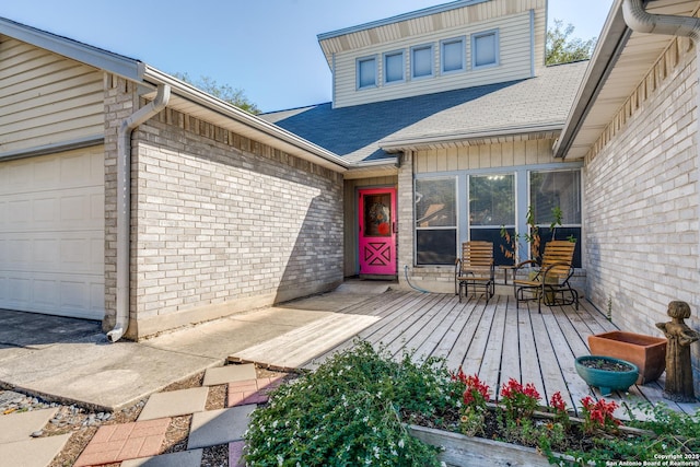 doorway to property with a garage