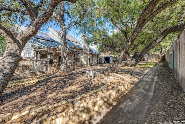 9018 Brickwood, San Antonio, TX 78250 - view of yard featuring an outdoor structure and a fenced backyard