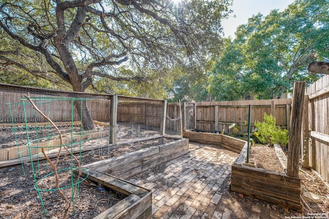 9018 Brickwood, San Antonio, TX 78250 - wooden deck featuring a fenced backyard and a vegetable garden