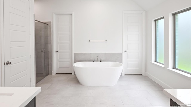 3157 Bee Hl, Schertz, TX 78108 - full bath featuring vanity, a soaking tub, a shower stall, and tile patterned flooring