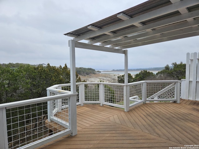 wooden terrace with a water view