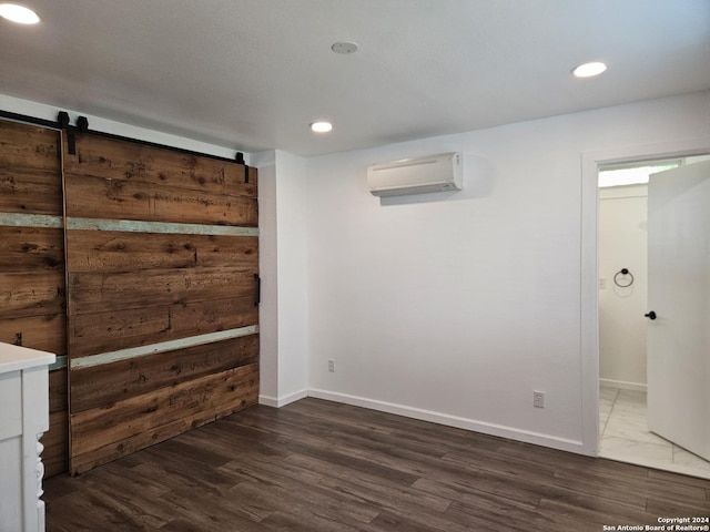 interior space featuring an AC wall unit and dark wood-type flooring