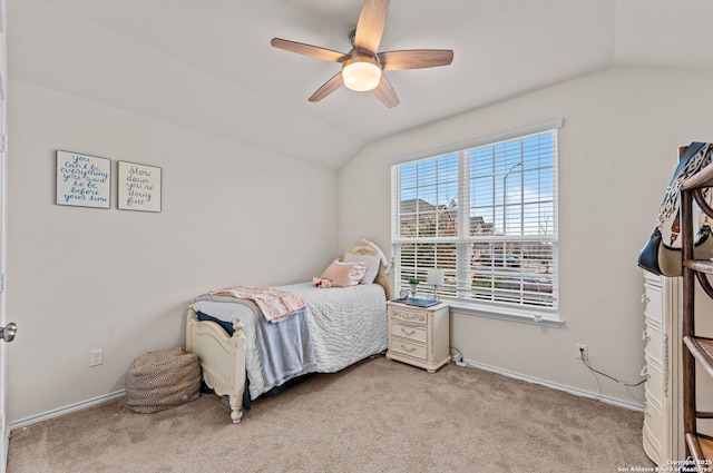 bedroom with lofted ceiling, light carpet, and ceiling fan