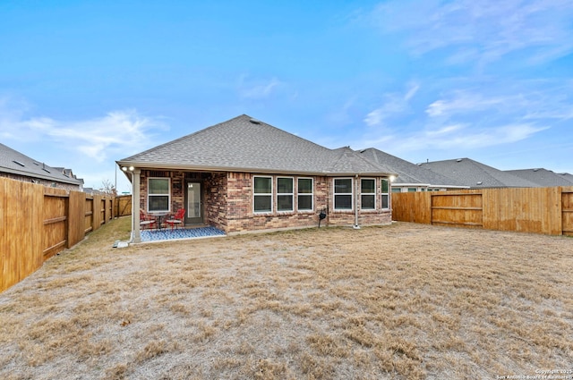 rear view of house with a patio