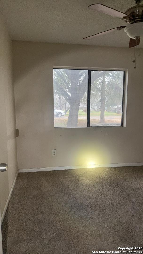 521 Quail Ln, Floresville, TX 78114 - unfurnished room featuring ceiling fan, carpet floors, and a textured ceiling