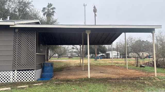 521 Quail Ln, Floresville, TX 78114 - view of yard featuring a carport