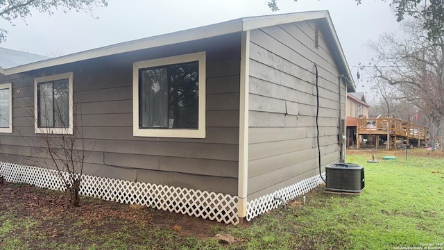 521 Quail Ln, Floresville, TX 78114 - view of side of property featuring central AC unit and a yard