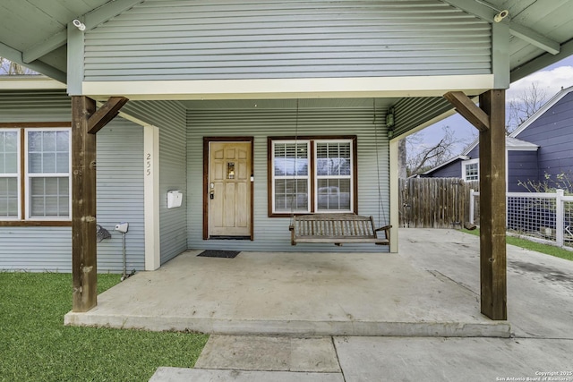 doorway to property featuring covered porch