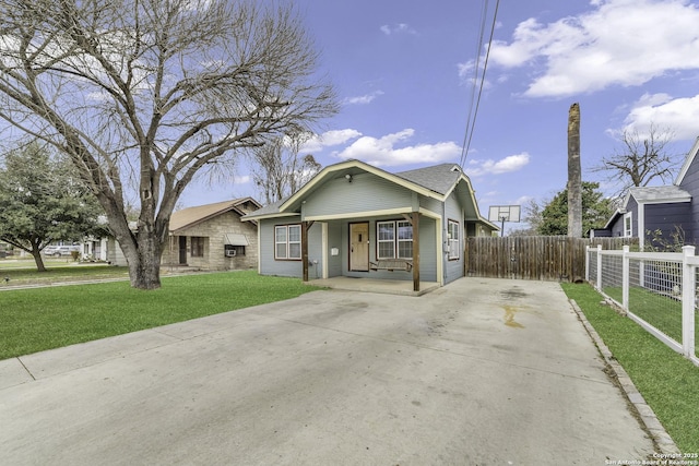 bungalow-style house with a front lawn