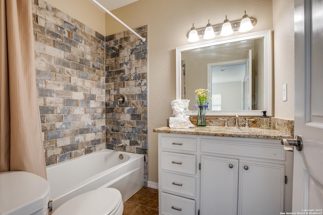 full bathroom with vanity, toilet, tile patterned flooring, and shower / bath combo