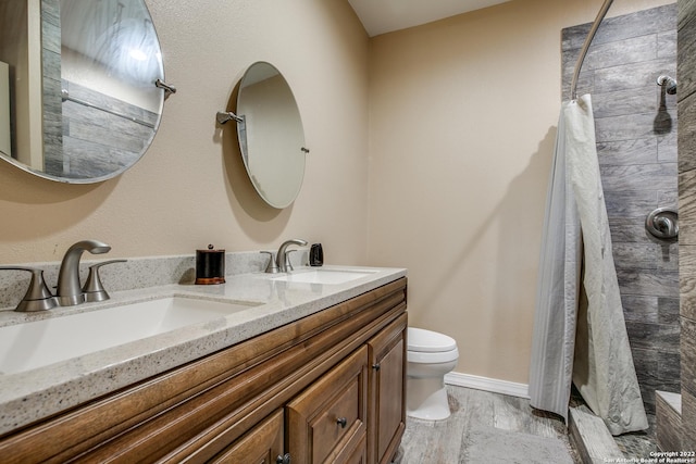 bathroom featuring hardwood / wood-style flooring, vanity, and toilet