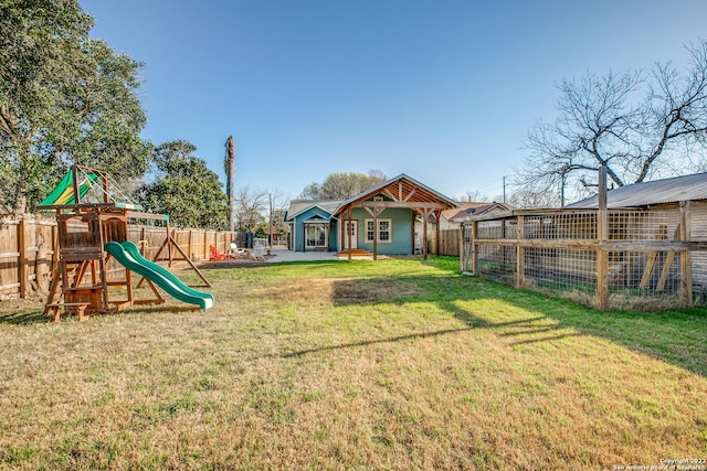 view of jungle gym with a lawn