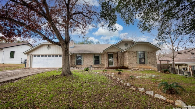 view of front of house with a garage and a front lawn