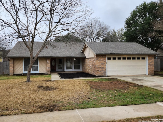 view of front of house featuring a garage and a front yard