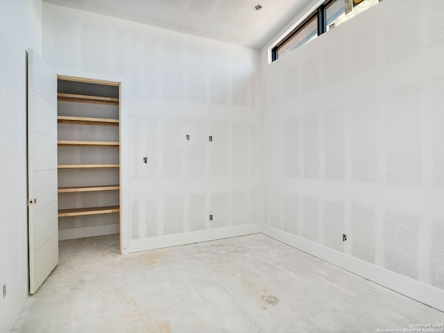 spare room with concrete flooring