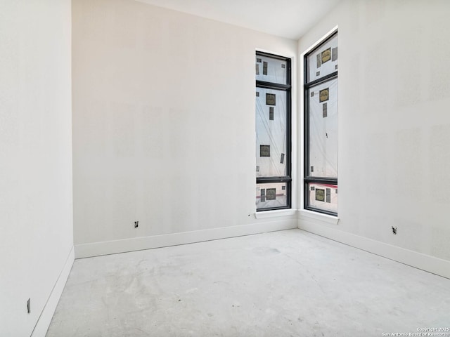 spare room featuring concrete floors