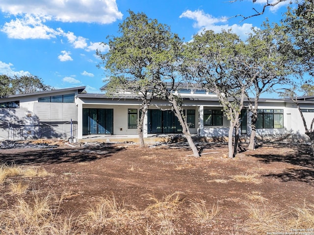 rear view of house featuring a patio