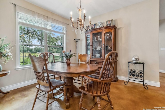 dining space featuring a notable chandelier