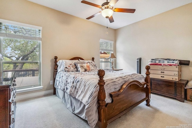 bedroom with light carpet and ceiling fan