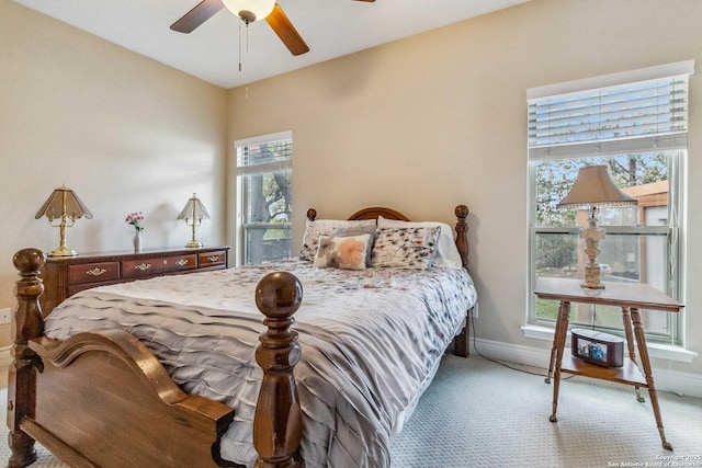 bedroom with light colored carpet and ceiling fan