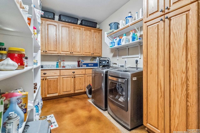 laundry area with cabinets and separate washer and dryer