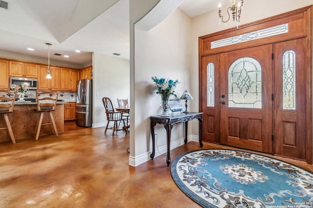 foyer entrance featuring concrete floors