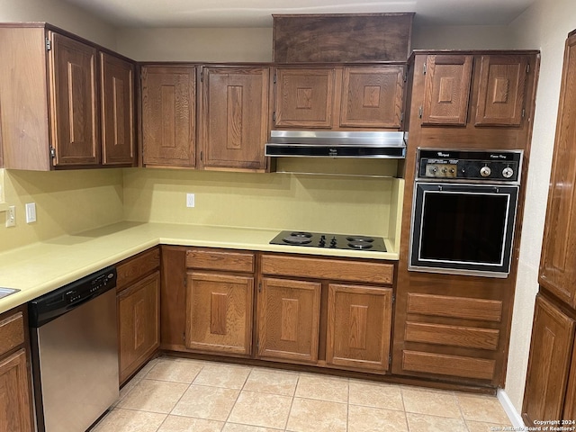 kitchen featuring light tile patterned floors and black appliances