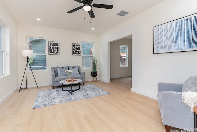 sitting room featuring ceiling fan and light hardwood / wood-style flooring