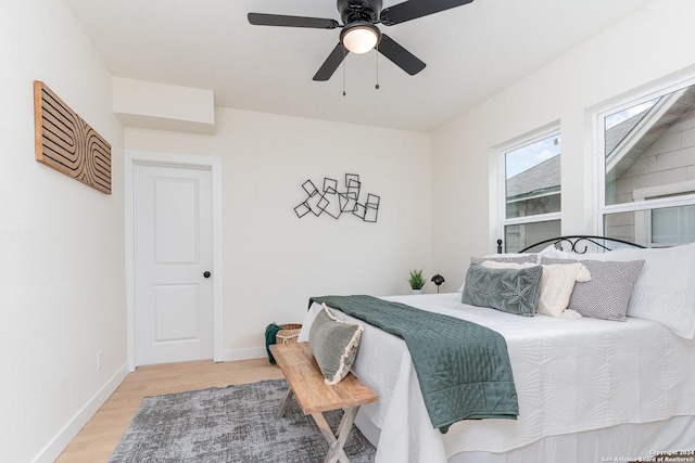 bedroom featuring ceiling fan and wood-type flooring