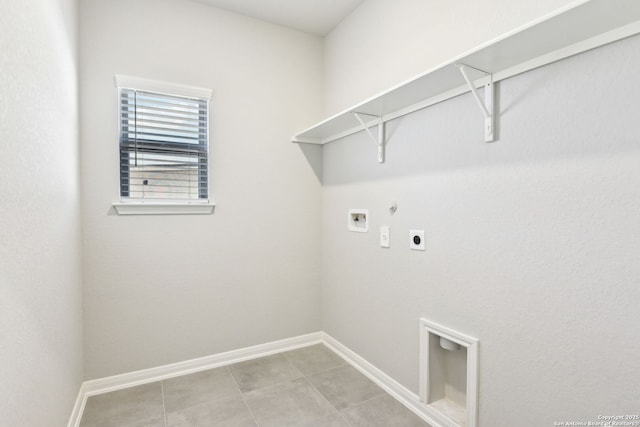 washroom with baseboards, gas dryer hookup, washer hookup, laundry area, and electric dryer hookup