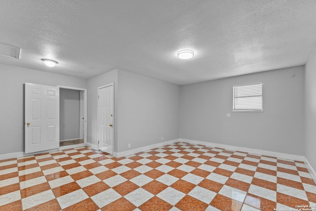 basement featuring a textured ceiling