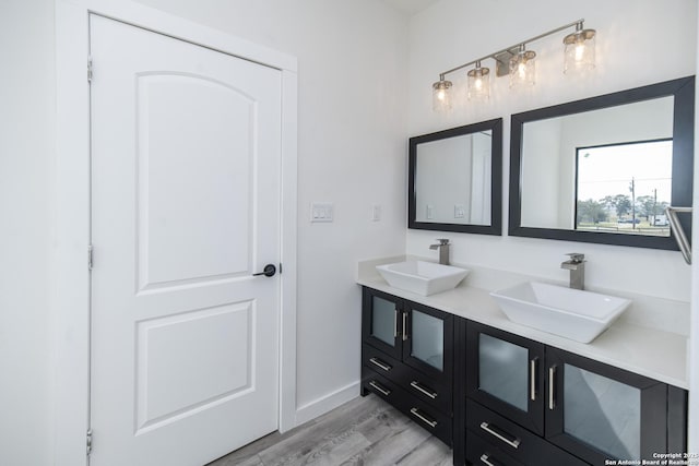 bathroom with vanity and hardwood / wood-style flooring