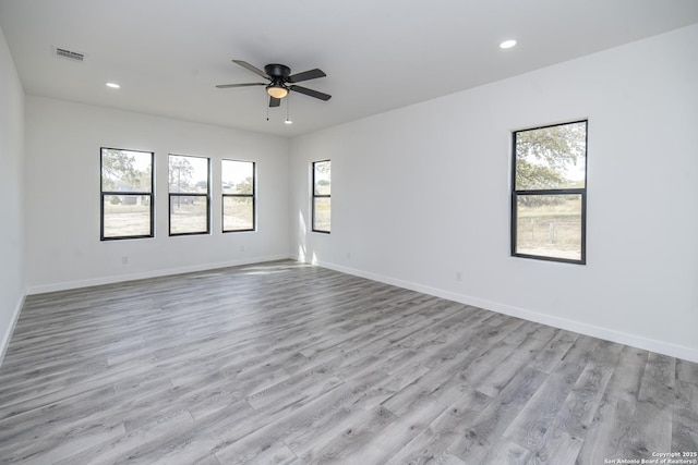 empty room featuring light hardwood / wood-style floors and ceiling fan