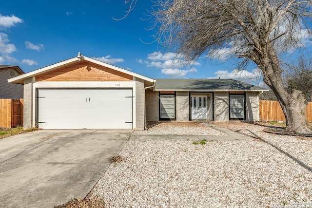 single story home featuring a garage